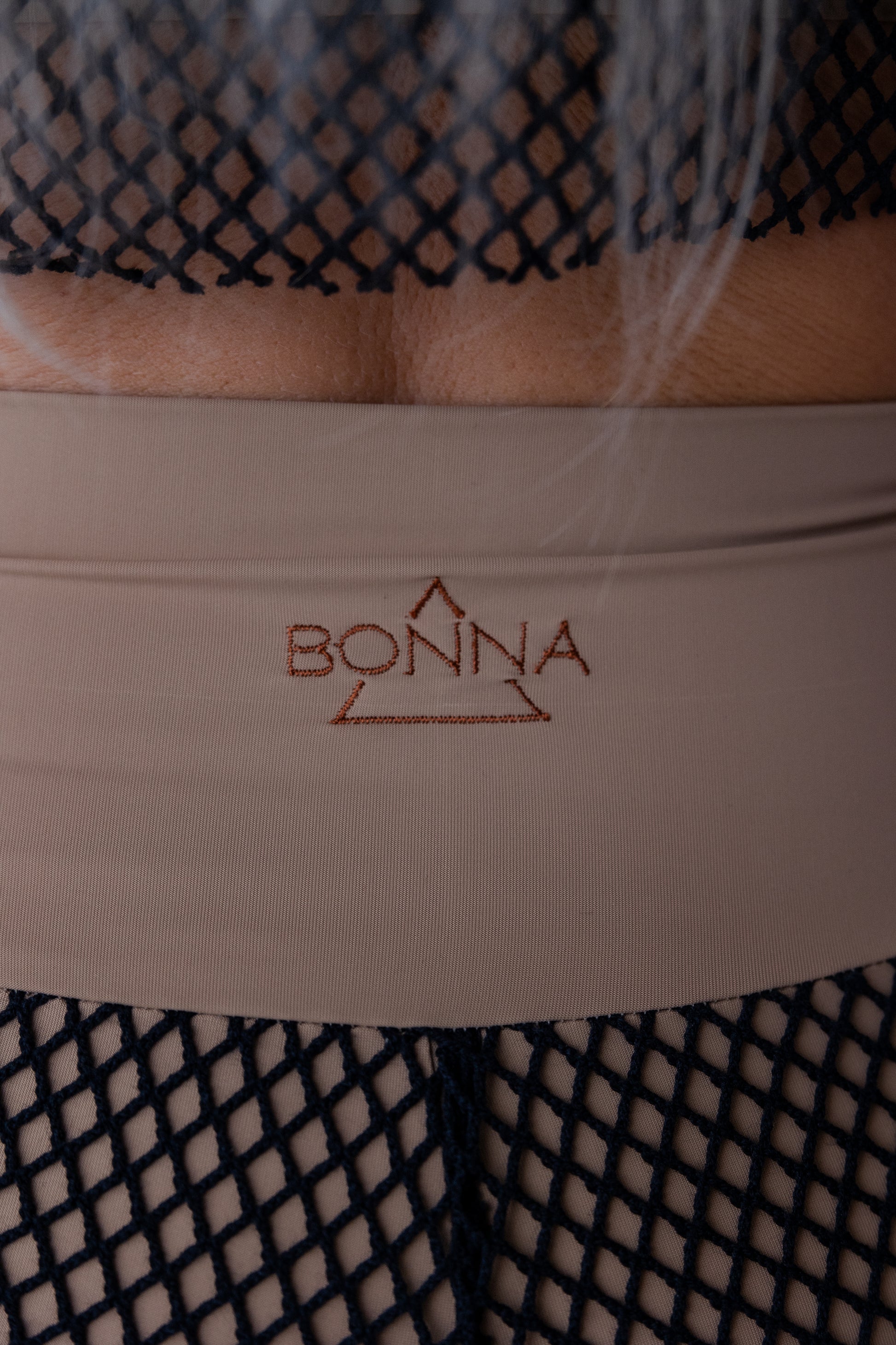 Close-up of a product with 'Bonna' branding on a textured background